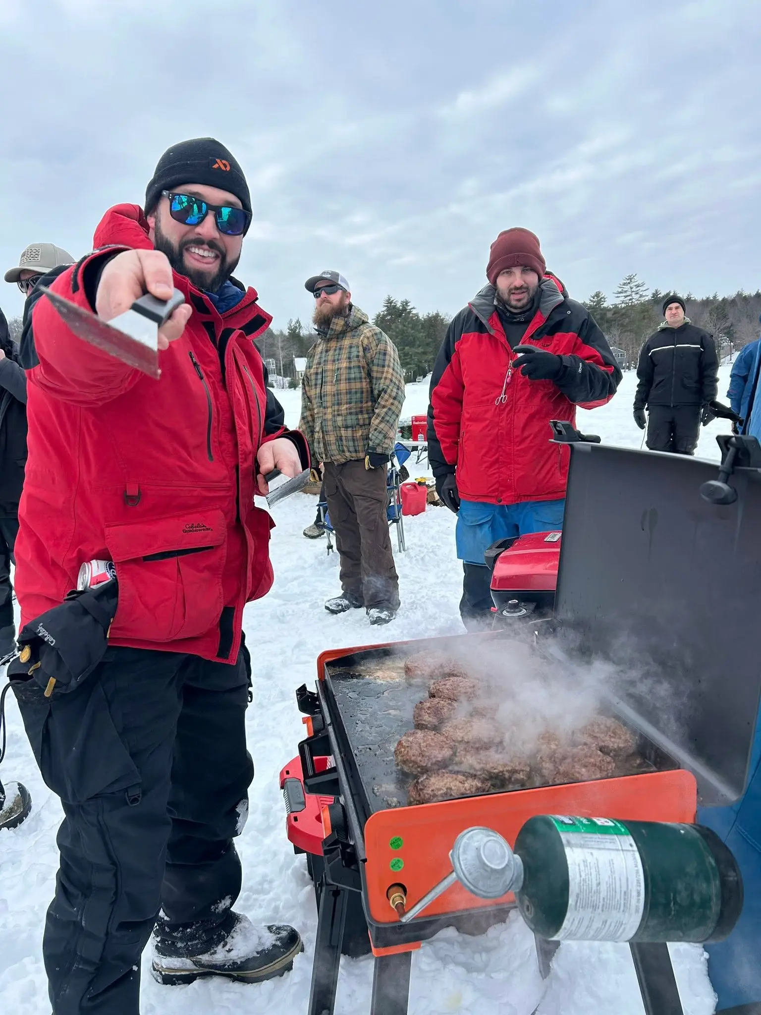 Grilling burgers on the ice at a Fishing for Freedom event