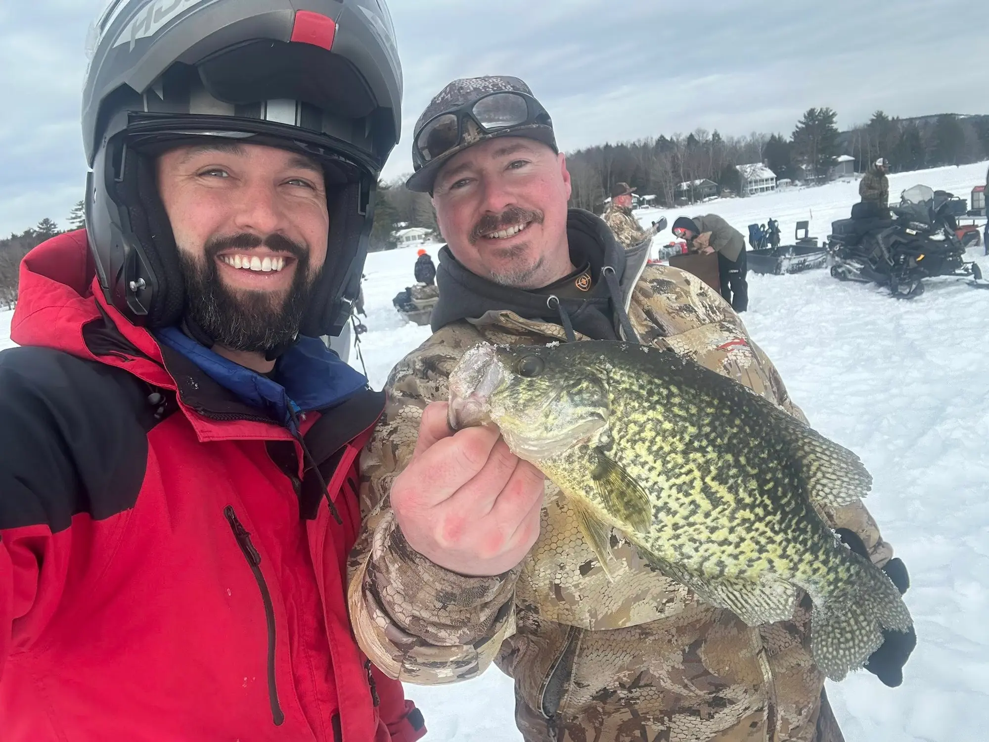 Two members showing off a great crappie catch at a Fishing for Freedom outing